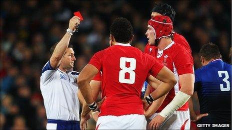 Referee Alain Rolland dismisses Wales captiain Sam Warburton