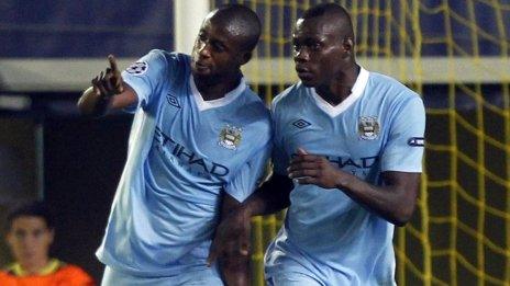 Manchester City's Yaya Toure (left) is congratulated by team-mate Mario Balotelli after scoring a goal