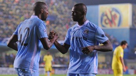 Yaya Toure of Manchester City celebrates scoring to make it 3-0 with Mario Balotelli