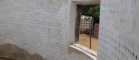 Inside walls of the sand bottle house