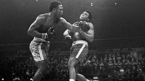 Joe Frazier (left) hits Muhammad Ali during the 15th round of their heavyweight title fight at New York's Madison Square garden in 1971