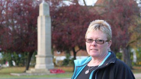 Helena Tym standing before Caversham war memorial