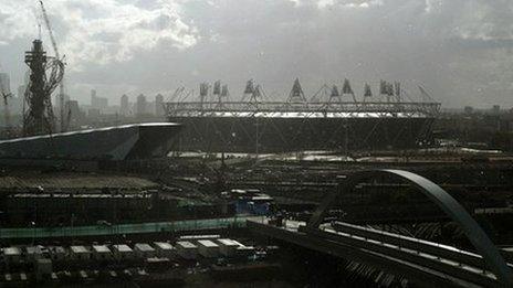 View of Olympic stadium, with London's Canary Wharf business district in the background, file pic from October 2011