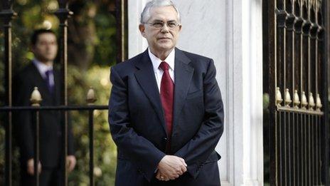 Lucas Papademos stands outside the presidential palace in Athens, 10 November