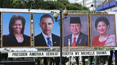 Posters showing the US and Indonesia presidents and their wives, in Jakarta on 9 November 2010