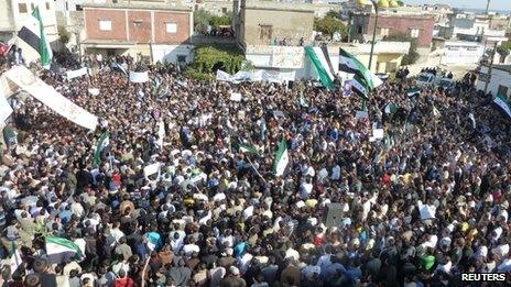 Opposition supporters rally in the Syrian town of Hula, 13 November