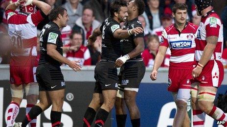 Clement Poitrenaud (centre) celebrates his winning try against Gloucester