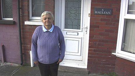 Enid Jones outside her house