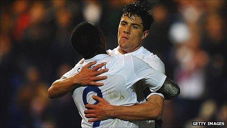 Martin Kelly celebrates