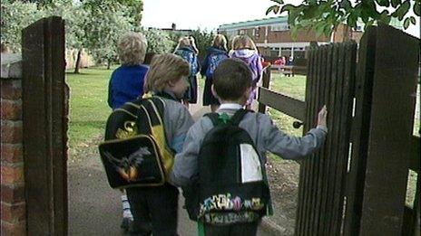 Children enter school grounds