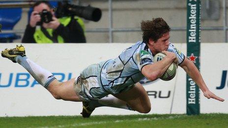 Blues scrum-half Lloyd Williams crosses for a try