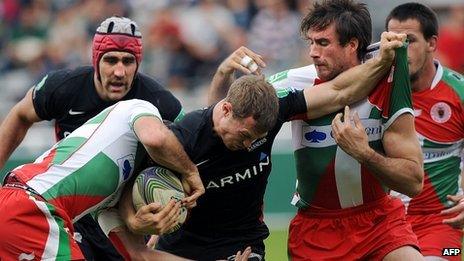 Saracens' James Short fights off Biarritz's tacklers