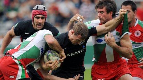 Saracens' James Short fights off Biarritz's tacklers