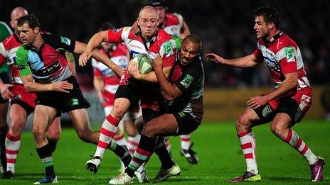 Gloucester's Mike Tindall tries to evade Harlequins' Jordan Turner-Hall