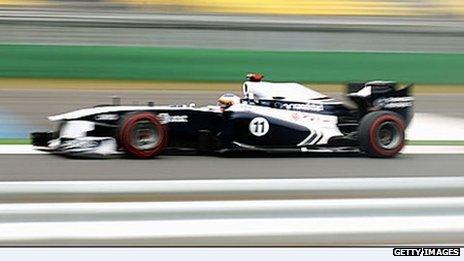 Williams driver Rubens Barrichello in his Randstad branded car