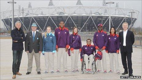 Jonathan Edwards (left) and Paul Deighton (right) with some Games Makers and officials in their new uniforms