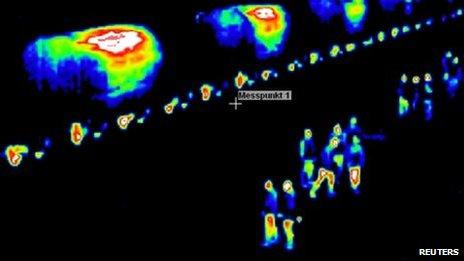 Thermal imaging shows police guarding the nuclear waste train near Saarbruecken, 25 November