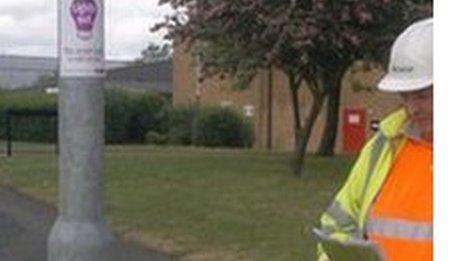 Workers assess the lights