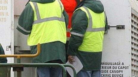 Workmen in high-vis jackets