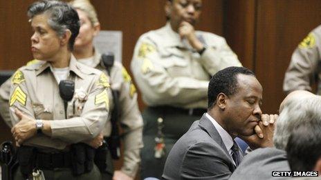 Dr Conrad Murray closes his eyes after he is sentenced