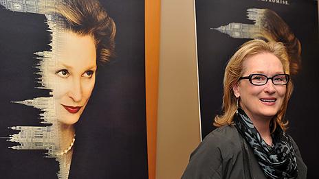 Meryl Streep with a poster for The Iron Lady