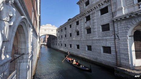 A gondola passes Venice's Bridge of Sighs after it was renovated (December 1, 2011)