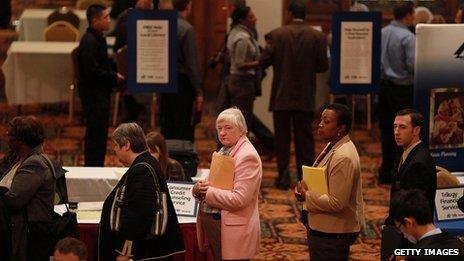 Job seekers wait in line to meet with a recruiter at a job fair in San Francisco, California, on 9 November 2011