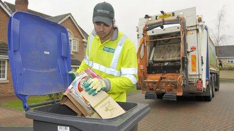 Man using recycling bins