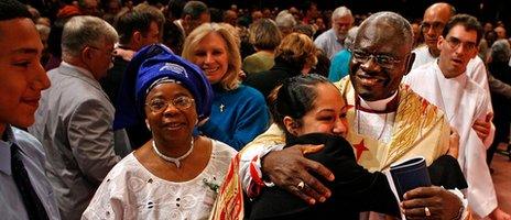 Nigeria's Anglican Archbishop Peter Akinola (R) is embraced by congregants during the investiture of the Right Rev. Martyn Minns as the missionary bishop of the Convocation of Anglicans in North America (5 May 2007)