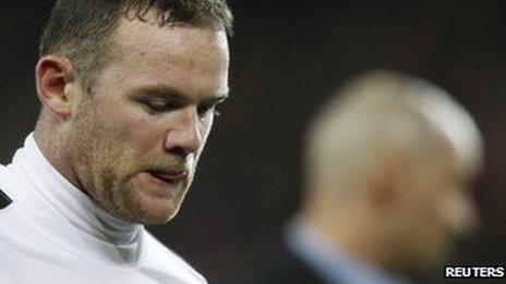 Wayne Rooney leaves the pitch after Manchester United are knocked out of the Champions League