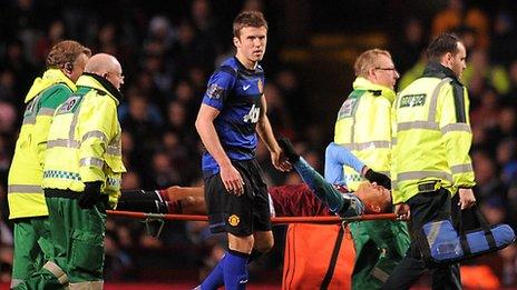 Jenas is stretchered off after injuring his Achilles against Manchester United