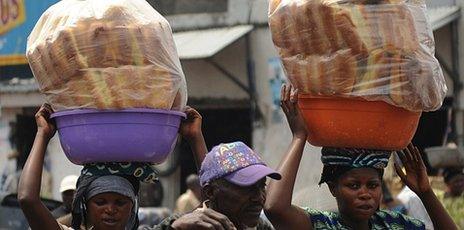 Congolese women sell bread in the streets of Goma on 5 December 2011