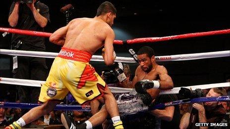 Lamont Peterson is knocked down