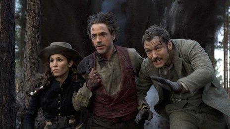 Noomi Rapace, Robert Downey Jr and Jude Law in Sherlock Holmes: A Game Of Shadows