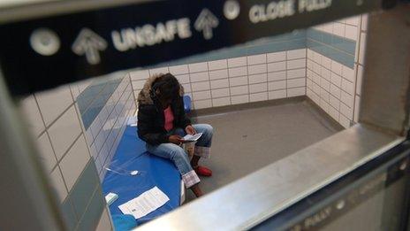 A youngster held in a prison cell