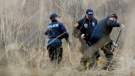 Crime Scene investigators use metal detectors to search a marsh for the remains of Shannan Gilbert 12 December 2011