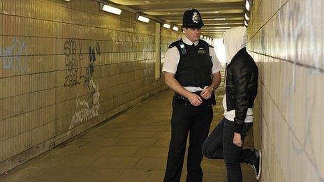 Police officer talking to youth