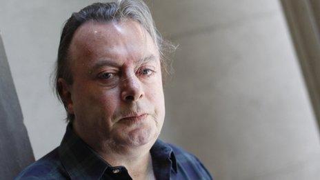 Author Christopher Hitchens poses for a portrait outside his hotel in New York, June 2010