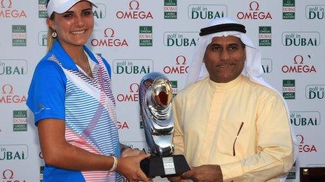 Lexi Thompson receives the Dubai Ladies Masters trophy