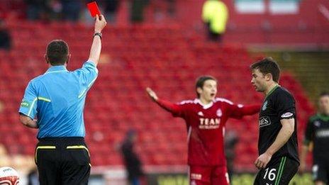 Referee Craig Thomson shows Peter Pawlett the red card