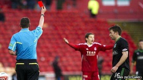 Referee Craig Thomson shows Peter Pawlett the red card