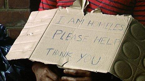 Cardboard sign reading: 'I am homeless please help. Thank you'