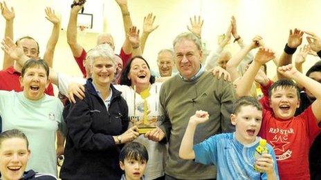 Janice Eaglesham and Ian Mirfin hold their regional award