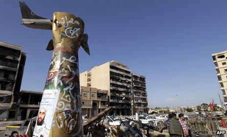 Famous statue of an iron fist crushing an American warplane, now standing in Misrata