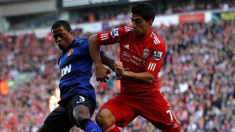 Patrice Evra and Luis Suarez