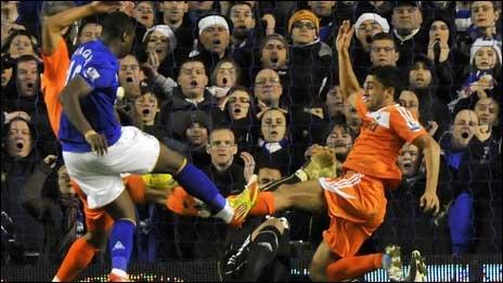 Neil Taylor stretches for the ball