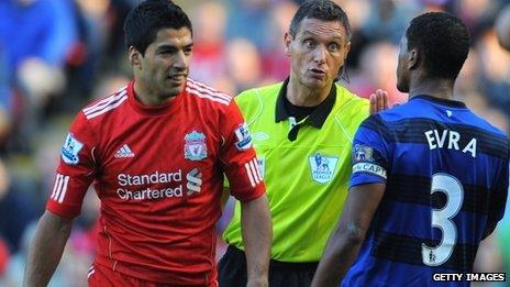 Liverpool's Luis Suarez (left) and Manchester United's Patrice Evra during the game in October