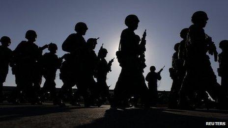 Soldiers walk in formation during the inauguration of military barracks in Ciudad Mier in Tamaulipas state December 2011.