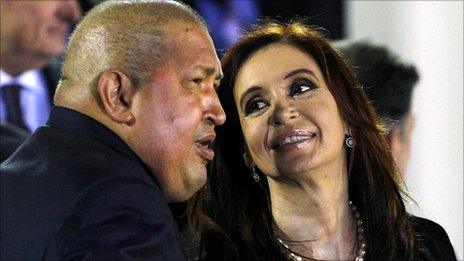 Venezuelan President Hugo Chavez chats with Cristina Fernandez de Kirchner of Argentina, 2 December 2011