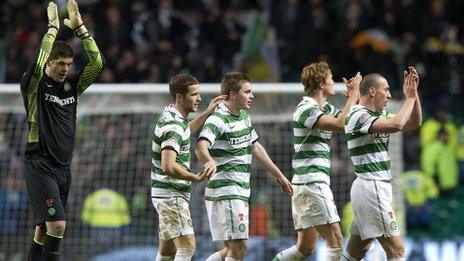 Celtic players applaud their fans following the win over Rangers